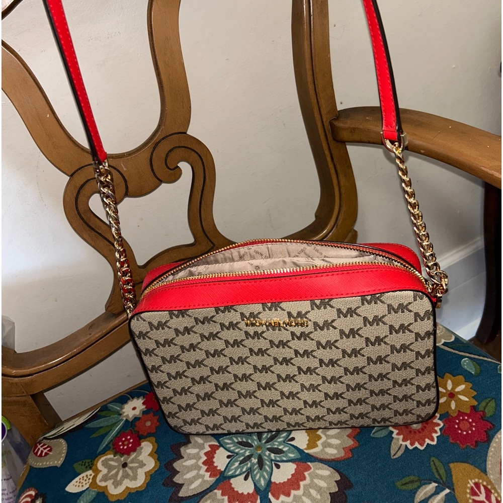 Michael Kors crossbody in excellent condition. Tan and Red trim. Super cute!